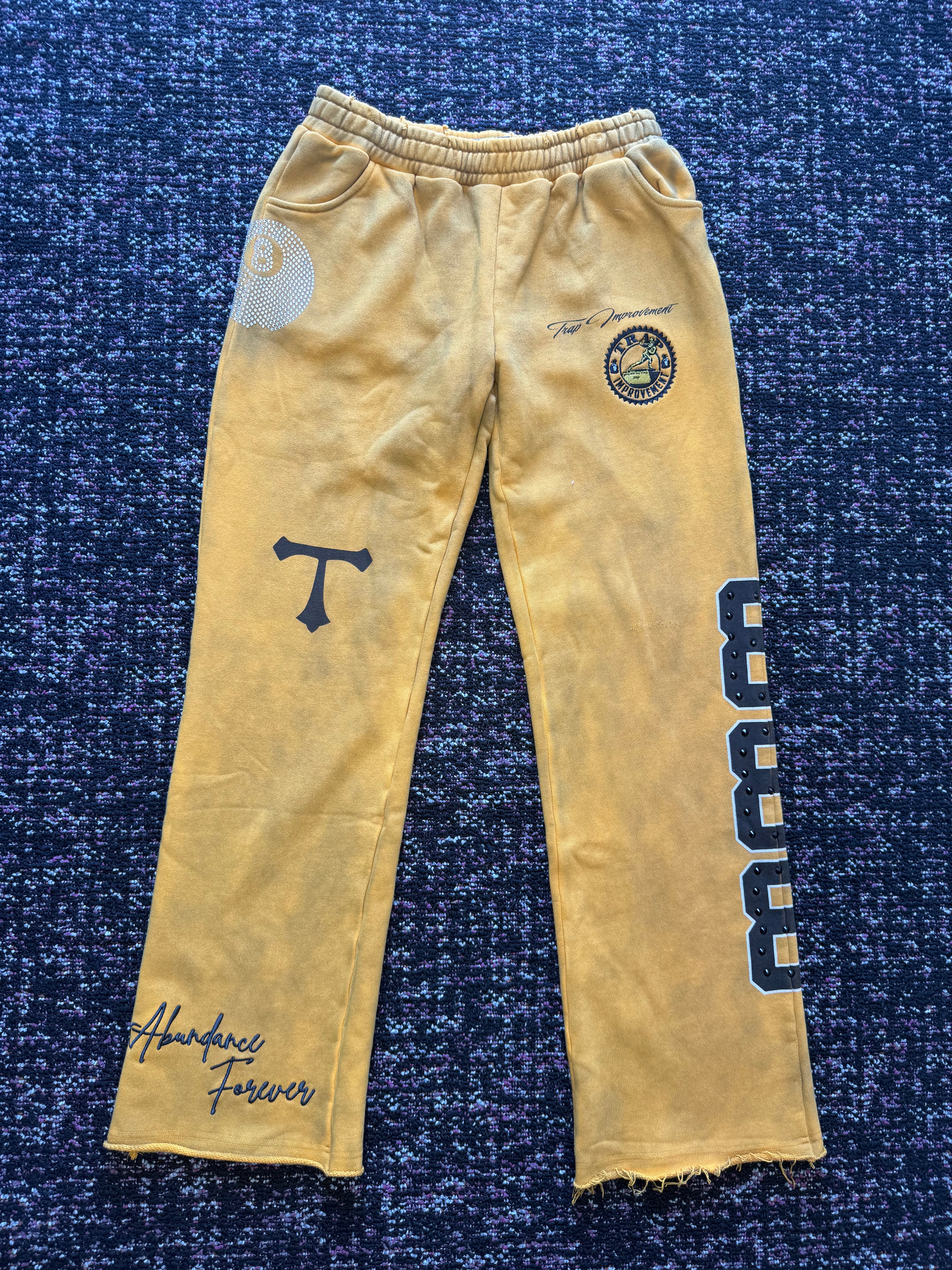 Trap Improvement Gold Sweats
